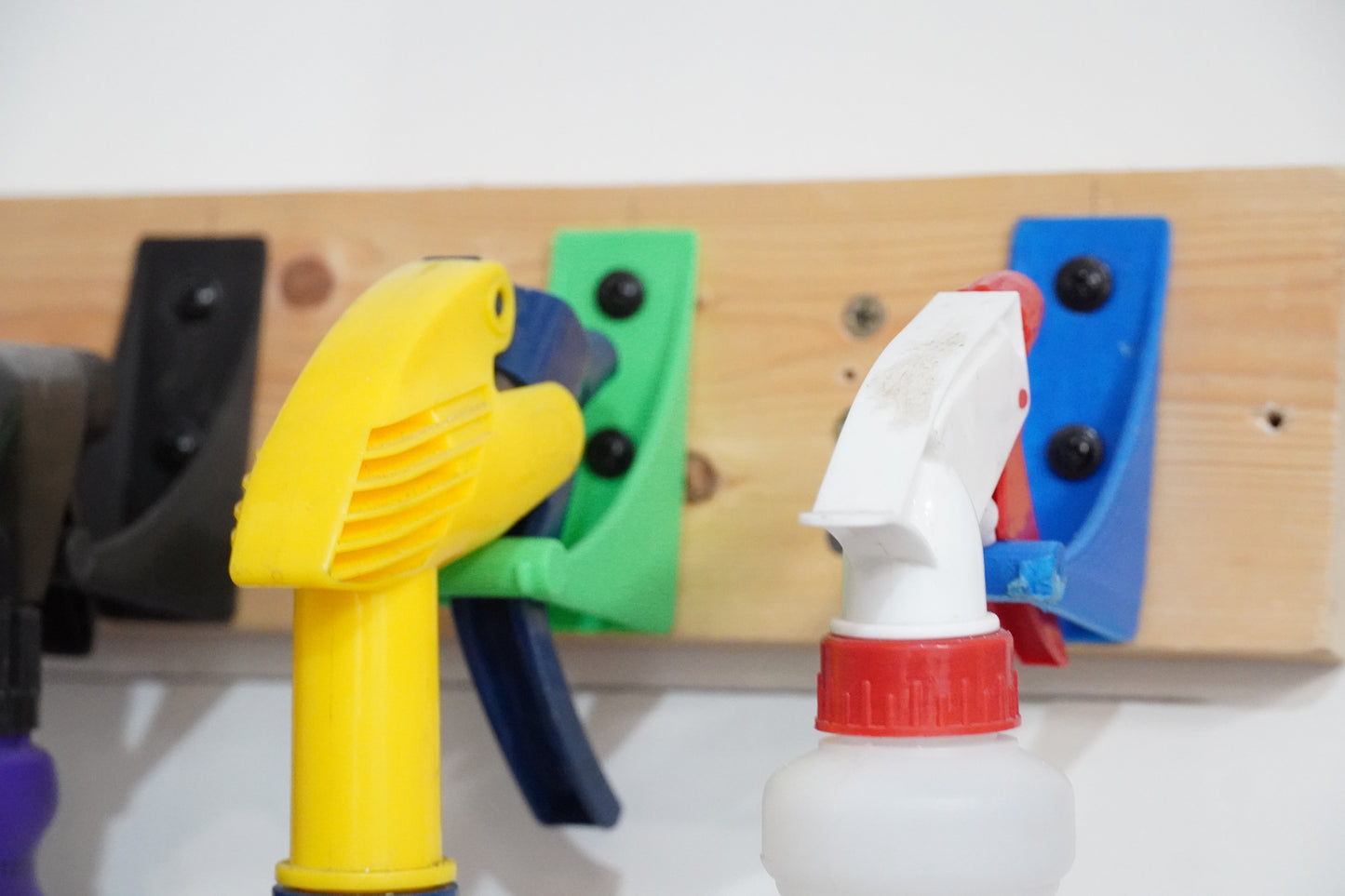 The SprayDock spray bottle wall mounted rack