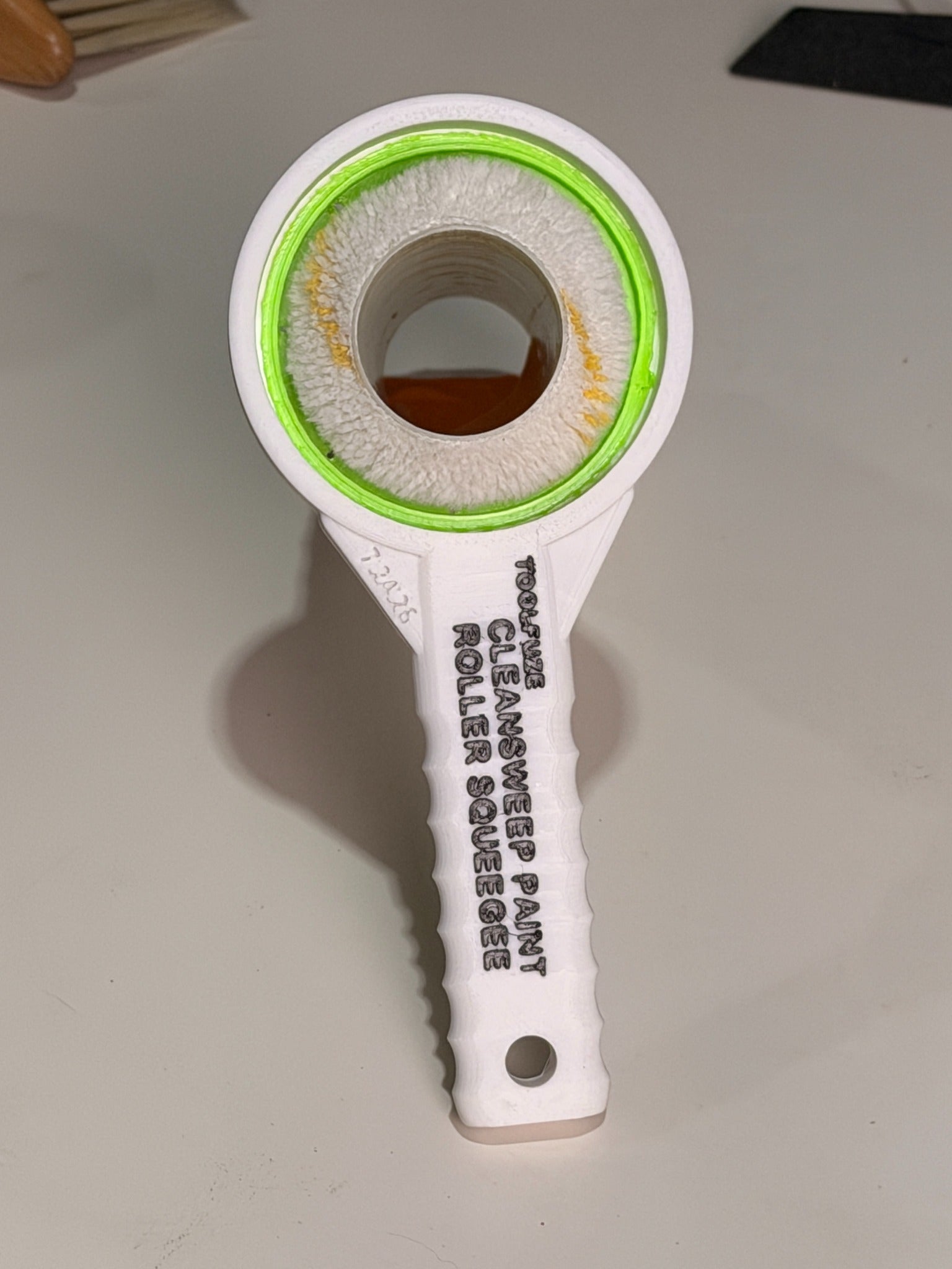CleanSweep Flex flexible TPU ring fitted around a paint roller cover