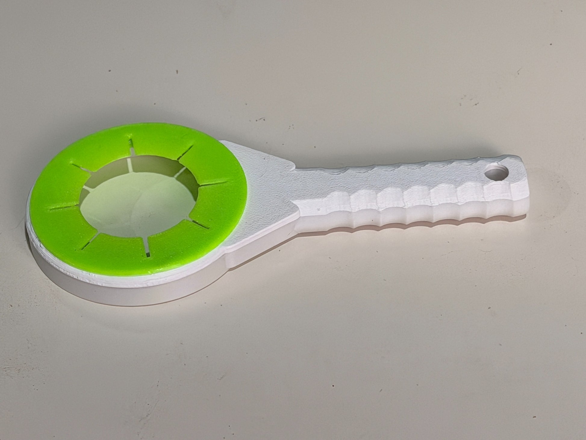 CleanSweep Flex paint roller squeegee with flexible green TPU ring and sturdy white handle
